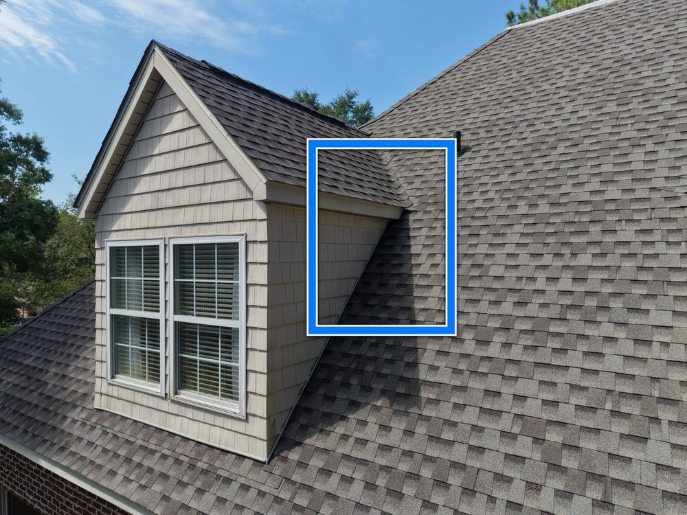Close-up of a roof valley where a dormer meets the main roofline