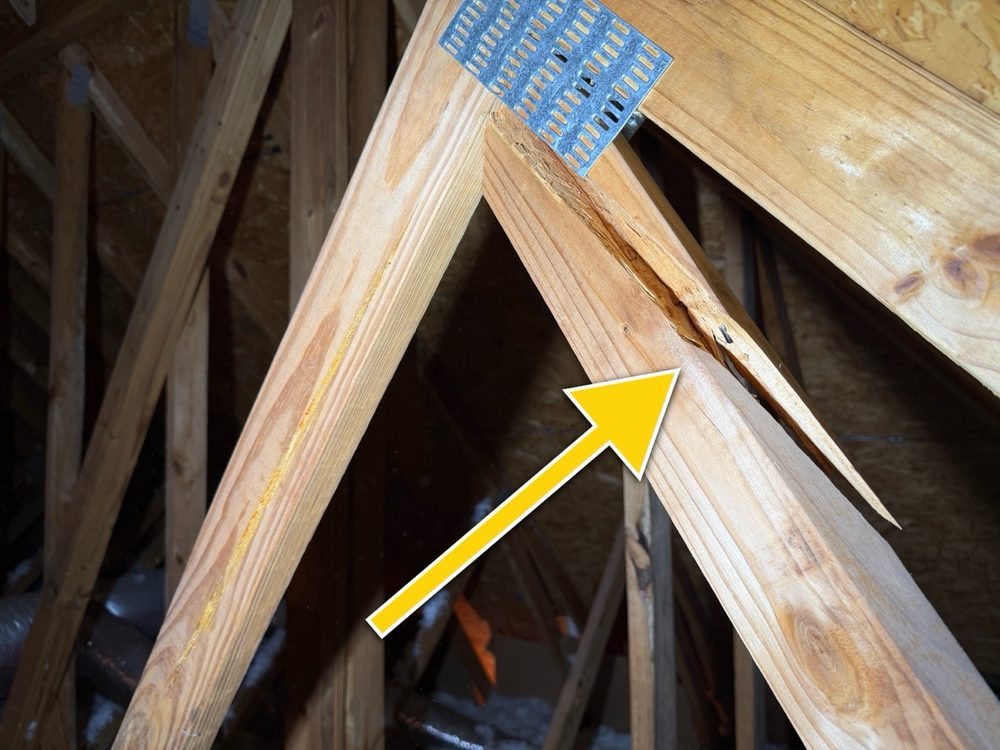 Split at a roof truss connection near a metal gusset plate